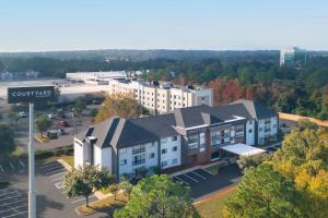 an aerial view of a building with a parking lot at Courtyard Mobile in Mobile