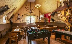 a restaurant with a pool table in the middle of a room at Willa Florynka in Biały Dunajec