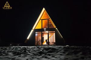 a small chapel in the snow at night at Weekend house - Vlašić in Vlasic