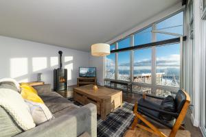 TV a/nebo společenská místnost v ubytování Les Chalets du Massif de Charlevoix