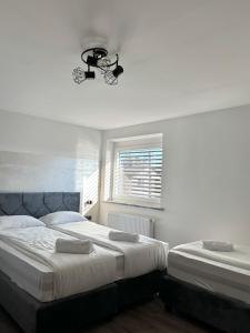 Postel nebo postele na pokoji v ubytování L&L rooms + 11 fotografií
