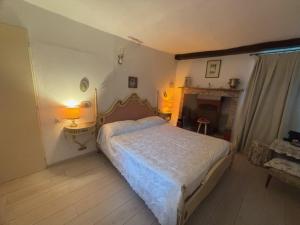 Una cama o camas en una habitación de Appartamento Camino