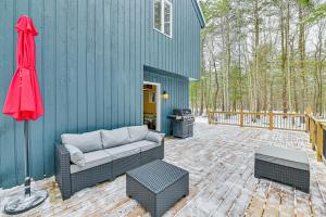 a patio with a couch and a table and a grill at Ski, Hike and Golf Pet-Friendly Windham Retreat in Windham