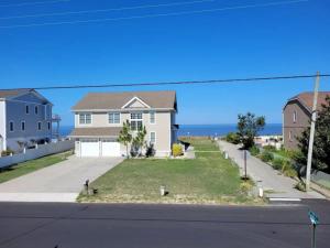 a house with a view of the ocean at Water View Cottage Steps to Beach in Villas