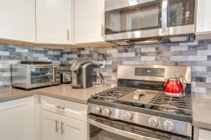a kitchen with a stove with a tea kettle on it at Near Hiking and Golf Cozy Cottage in Morgan Hill! in Morgan Hill
