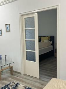 Postel nebo postele na pokoji v ubytování Életfa Pihenő Apartman