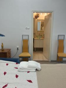 Postel nebo postele na pokoji v ubytování Életfa Pihenő Apartman