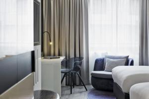 Letto o letti in una camera di Renaissance Vienna Schönbrunn Hotel