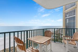 a balcony with a table and chairs and the ocean at Jade East Towers 0630 by Newman-Dailey in Destin
