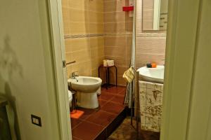 a bathroom with a toilet and a sink at B&B Liberty in Santa Maria Capua Vetere +11 photos