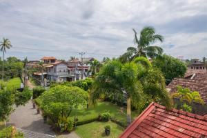 a view of a city with houses and palm trees at The garden gate resort & Apartments No 02 in Negombo
