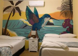 Ένα ή περισσότερα κρεβάτια σε δωμάτιο στο Sunset Hut Hostel