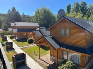 an overhead view of a house with solar panels on it at Complejo hotelero Illihue - Cabañas & Hostería in Junín de los Andes
