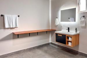 a bathroom with a sink and a mirror at CASA LUGO mx in El Porvenir