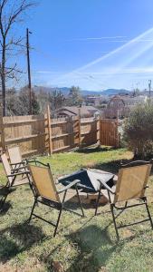 two lawn chairs and a table in a yard at Moroccan Pearl Luray VA in Luray +19 photos