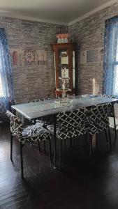 a dining room with a table and some chairs at Moroccan Pearl Luray VA in Luray