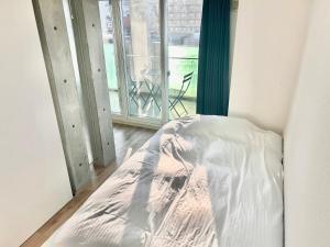 Postel nebo postele na pokoji v ubytování 【302号室】小樽キャナルビュー AMS東雲