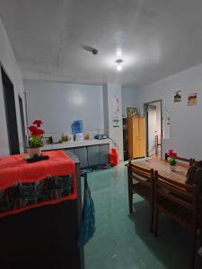 a room with a kitchen with a table and a table sidx sidx at Your home near Burnham Park in Baguio