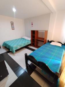 Giường trong phòng chung tại Casa cerca Centro, Salida Parque del Café, Panaca a minutos de Salento y Filandia rentalsOP Q01 +2 ảnh