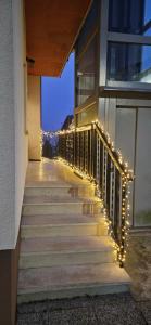 a stairway with lights on the side of a building at CASA Asani Pedavena in Pedavena