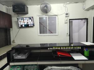a desk in a room with a window in a room at The Spring in Pattaya