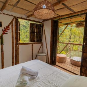 A bed or beds in a room at Victoria Ecolodge
