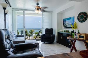 a living room with a couch and a chair at Casa Lily in Mazatlán