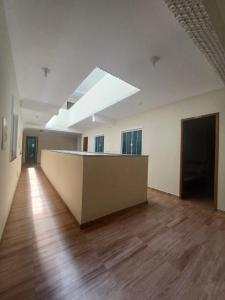 an empty room with a skylight in a building at Pousada Estrela Mares 101 in Cabo Frio +1 photo