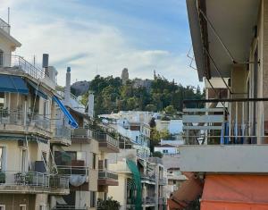 a view of a city with buildings at Spacious 2BDs Apt With Acropolis View In Center in Athens