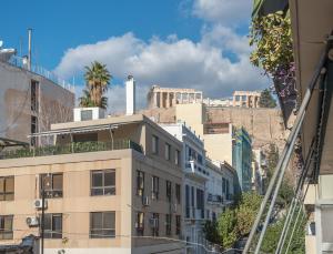 a view of the acropolis from a city at Spacious 2BDs Apt With Acropolis View In Center in Athens