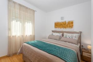 Posteľ alebo postele v izbe v ubytovaní Apartment Njivice 5295b