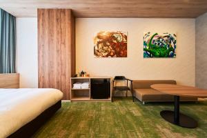Postel nebo postele na pokoji v ubytování Katsuyama New Hotel + 37 fotografií