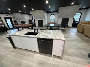 a large living room with a kitchen and a table at Long Lake Escape in Hammonds Plains +23 photos