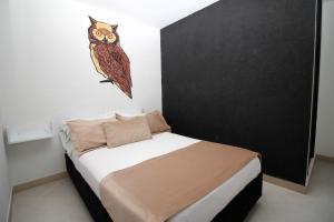 Voodi või voodid majutusasutuse DAM Hotel Pereira toas