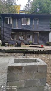 a blue house with a bench in front of it at hostel centro in Puerto Montt +10 photos
