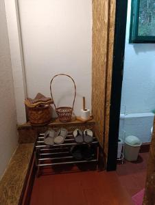 a group of shoes sitting on a shelf in a room at Brvnara Gromki - Mountain house in Han Pijesak +27 photos