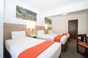 Кровать или кровати в номере Casa Andina Standard Cusco Catedral