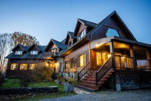 a large house with a gambrel roof at Sugar Hill Retreat #296692 in Lac-Brome