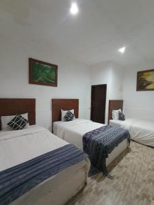 a room with two beds in a room at Wahyu Gili 1 in Gili Trawangan +40 photos