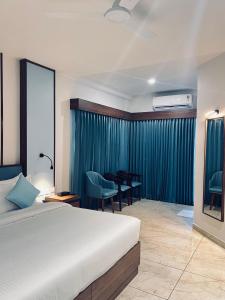 Sahya Regency客房内的一张或多张床位