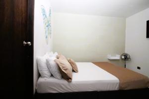 Voodi või voodid majutusasutuse DAM Hotel Pereira toas