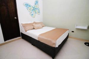 Voodi või voodid majutusasutuse DAM Hotel Pereira toas
