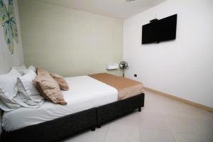 Voodi või voodid majutusasutuse DAM Hotel Pereira toas
