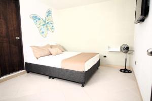 Voodi või voodid majutusasutuse DAM Hotel Pereira toas