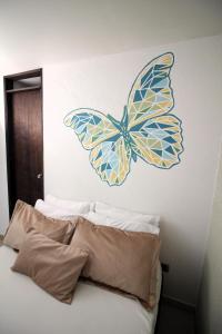 Voodi või voodid majutusasutuse DAM Hotel Pereira toas