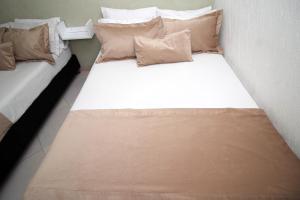 Voodi või voodid majutusasutuse DAM Hotel Pereira toas