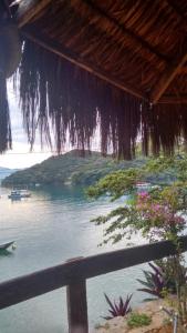 a view of a body of water with a beach at Suites com vista para o Mar in Angra dos Reis