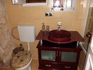 a bathroom with a sink and a toilet at Old Town Vrbnik Villas in Vrbnik