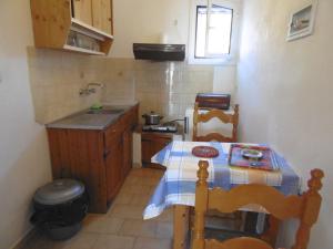 A kitchen or kitchenette at Apartments Elli - Nikos