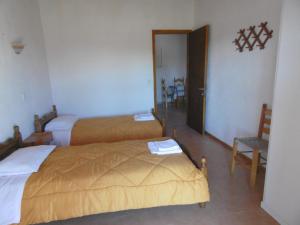 A bed or beds in a room at Apartments Elli - Nikos